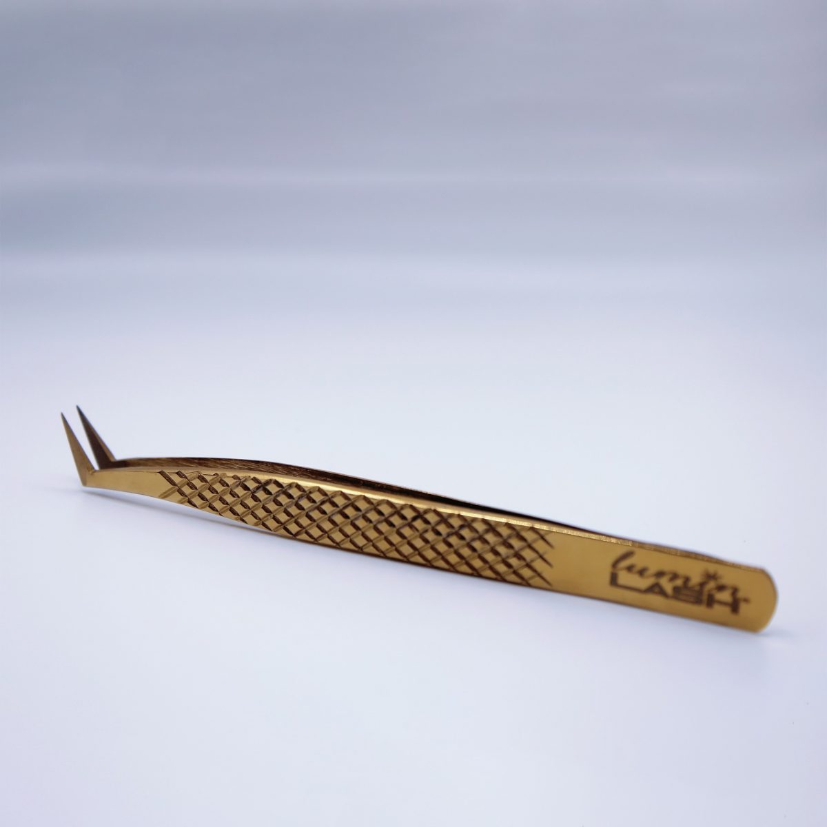 Volume-Diamond Gold Fiber Tip Tweezer